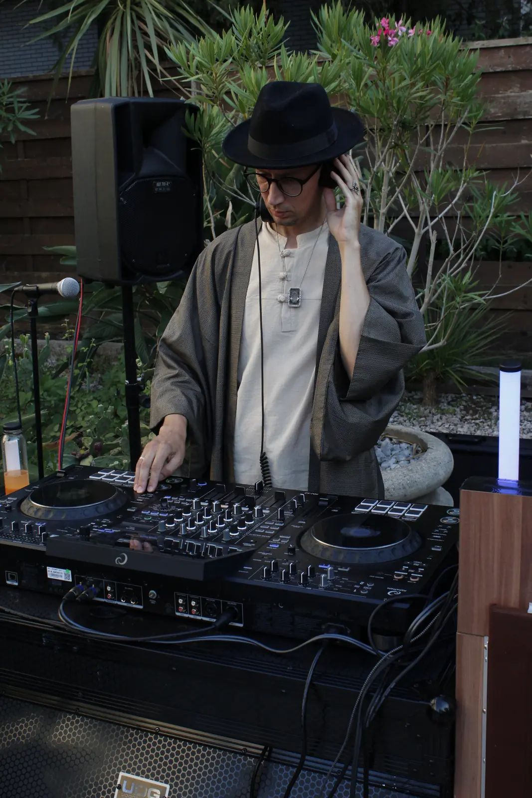 DJ performing at dusk on the studio terrace